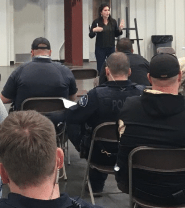 Melanie Squire public speaking to first responders